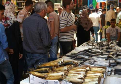 صور...العيد في نابلس..التسوّق والكعك والفسيخ طقوس لا تغيب