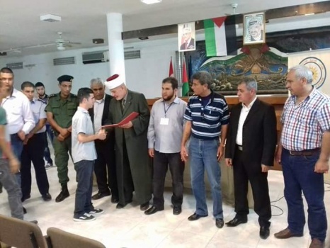 بالصور..الاحتفال في جنين بـ"يوم العصا البيضاء"