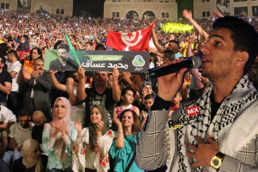 على أنغام "علي الكوفية والدحية" الفنان محمد عساف يشعل مدرجات روابي (صور وفيديو)