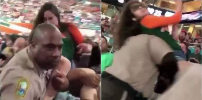 شرطي أمريكي يوجه لكمة لفتاة في ملعب لكرة القدم تُفقدها الوعي!!