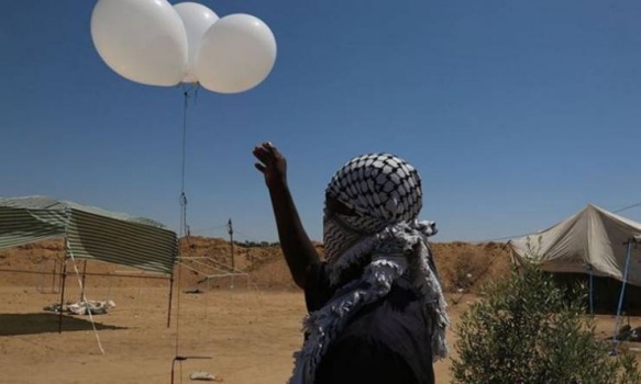 إسرائيل تهدد غزة بسبب البالونات الحارقة